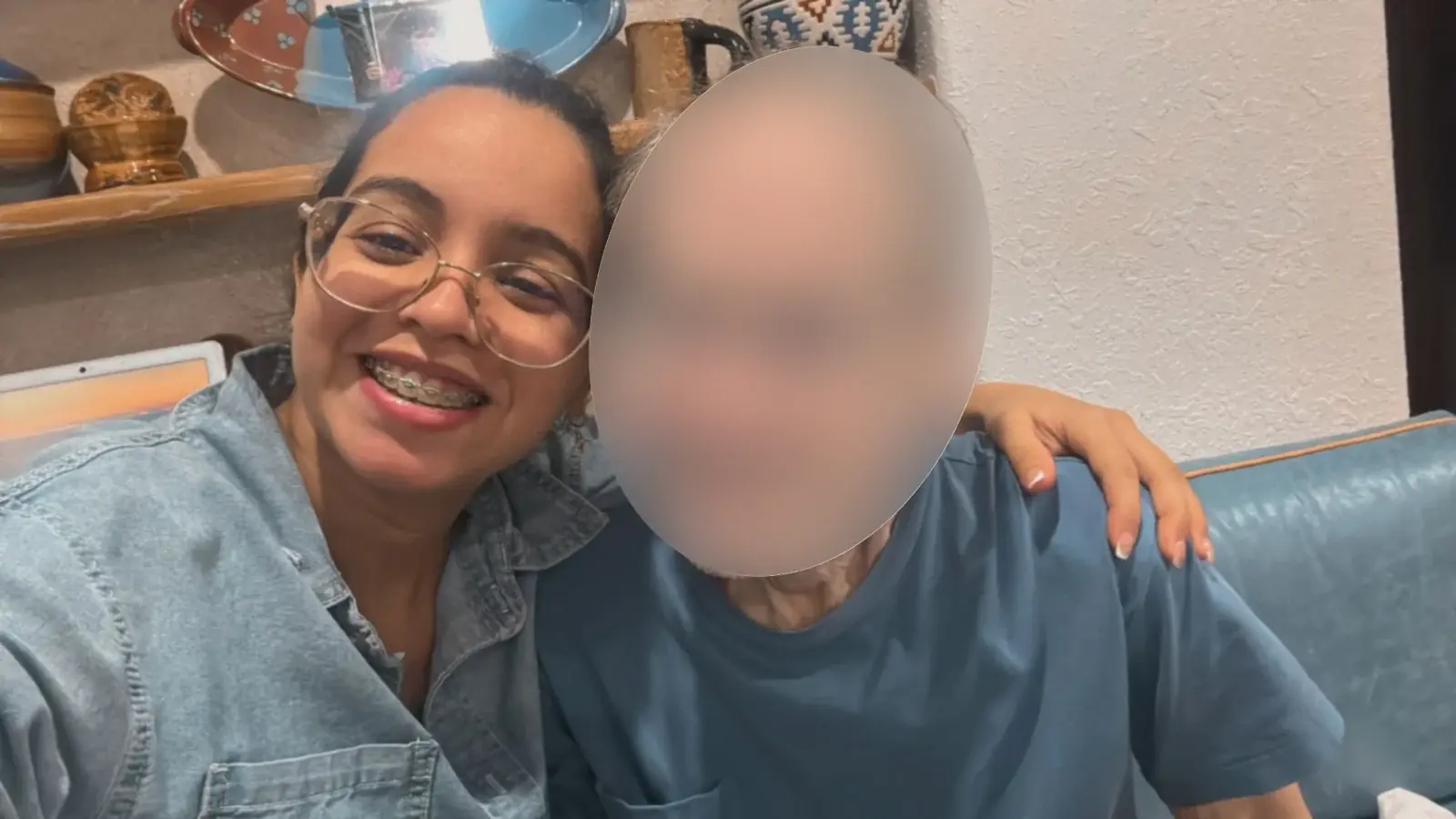 Ana connecting with an older adult whose face was obscured in the supplied photograph