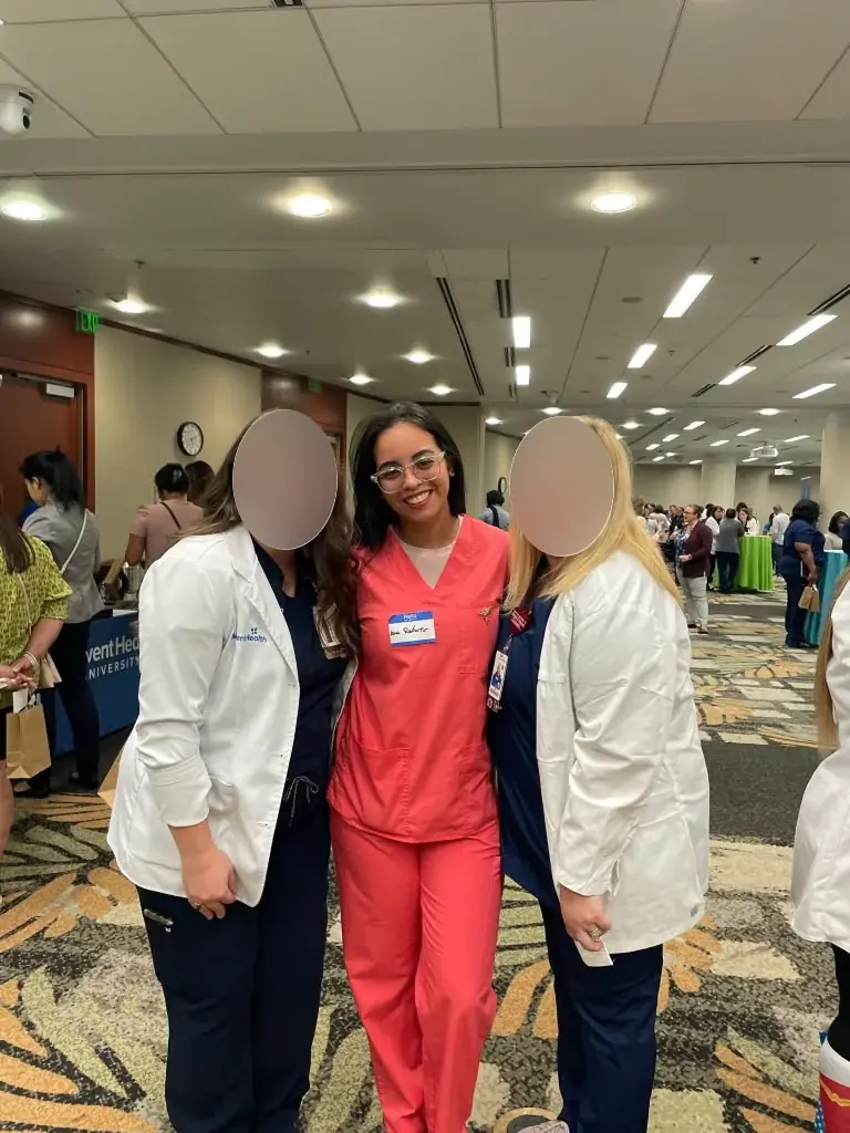 Ana with colleagues during her healthcare journey; faces are obscured in the supplied image